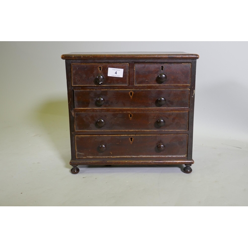 4 - A C19th miniature mahogany chest of two over three drawers, raised on bun feet, 35 x 17 x 33cm