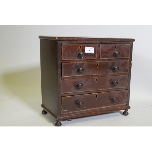 4 - A C19th miniature mahogany chest of two over three drawers, raised on bun feet, 35 x 17 x 33cm