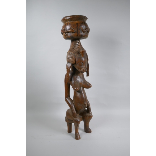 41 - An African carved hardwood Senufo maternity figure, 63cm high