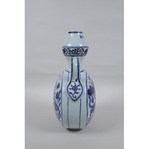 42 - A blue and white porcelain two handled garlic head shaped flask decoration with carp in a lotus pond... 