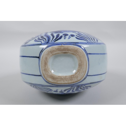 42 - A blue and white porcelain two handled garlic head shaped flask decoration with carp in a lotus pond... 