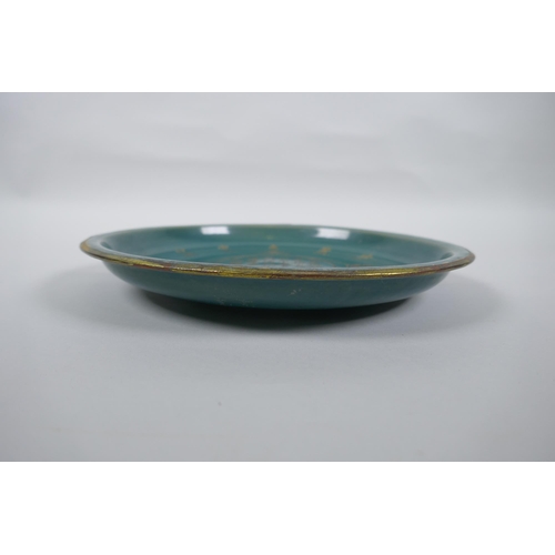 45 - A Chinese celadon crackle glazed porcelain dish with gilt metal rim and chased character inscription... 