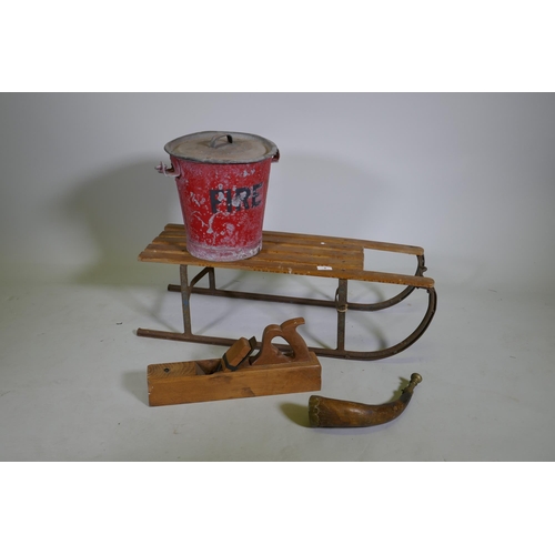 5 - A vintage child's sled, a painted galvanised metal fire bucket, brass mounted hunting horn and a blo... 