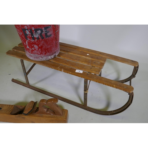 5 - A vintage child's sled, a painted galvanised metal fire bucket, brass mounted hunting horn and a blo... 