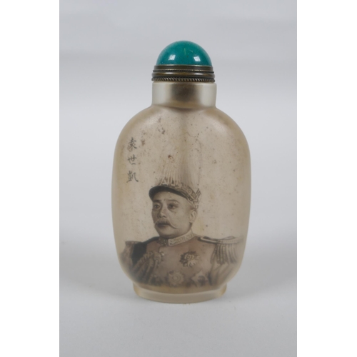 55 - A Chinese reverse decorated glass snuff bottle depicting a figure in military clothing, character in... 