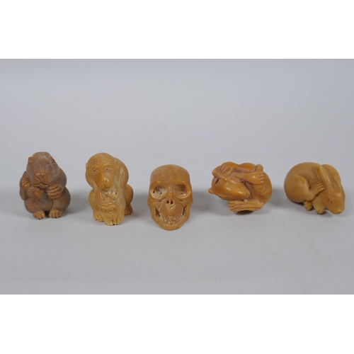 56 - Five Japanese carved tagua nut netsuke in the form of rabbits, rats, monkeys and a skull, largest 4c... 