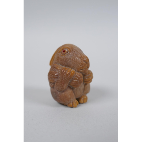 56 - Five Japanese carved tagua nut netsuke in the form of rabbits, rats, monkeys and a skull, largest 4c... 