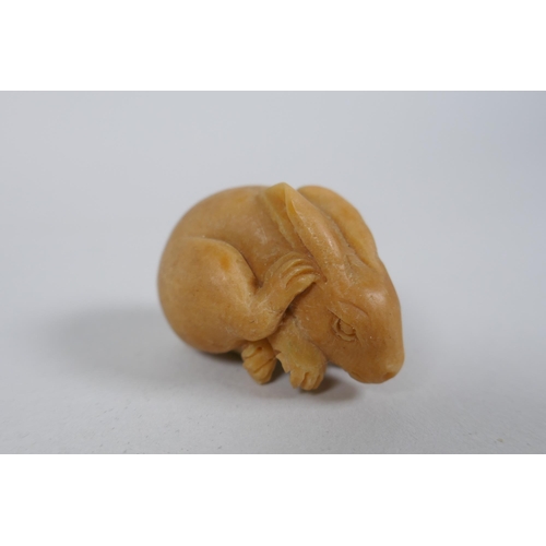 56 - Five Japanese carved tagua nut netsuke in the form of rabbits, rats, monkeys and a skull, largest 4c... 