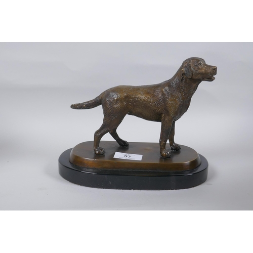 57 - A bronze figure of a dog, mounted on a marble base, unsigned, 17cm high