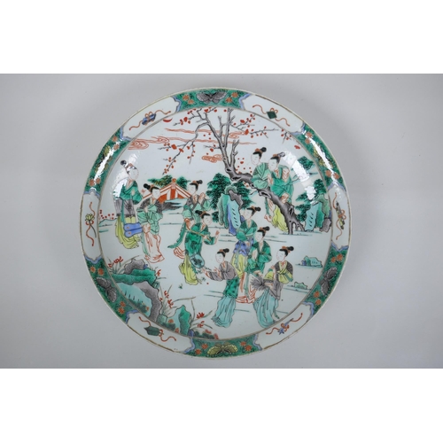 58 - A famille verte porcelain charger decorated with women in a garden, Chinese KangXi 6 character mark ... 