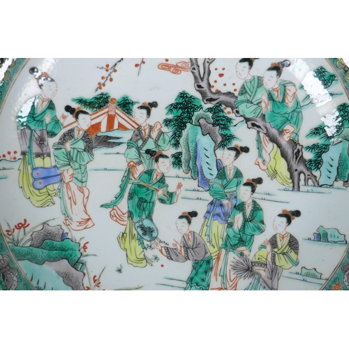 58 - A famille verte porcelain charger decorated with women in a garden, Chinese KangXi 6 character mark ... 