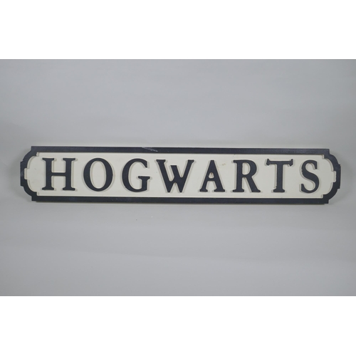 60 - A painted wood Harry Potter 'Hogwarts' road sign, 14 x 78cm long