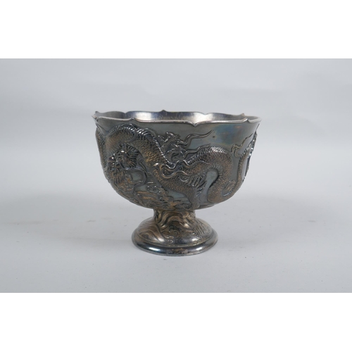 602 - An antique Japanese antimony stem bowl with raised dragon decoration, indistinct mark to base, 12cm ... 