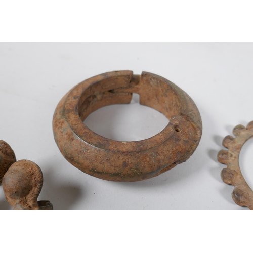 603 - A collection of antique Indian bangles and rings, largest 9cm diameter