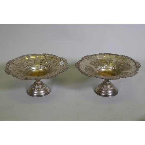 606 - A pair of Victorian Walker and Hall silver plated tazza, and a pair of silver plated fighting cocks,... 