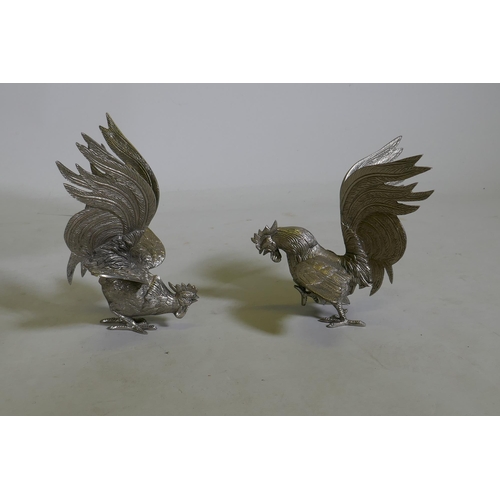 606 - A pair of Victorian Walker and Hall silver plated tazza, and a pair of silver plated fighting cocks,... 