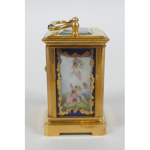 610 - A miniature brass cased carriage clock with Sevres style porcelain panels, 6cm high