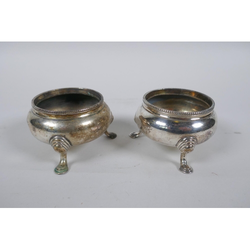 612 - A pair of hallmarked silver salts by Samuel Whitford, London 1869, and a Georgian silver salt spoon,... 