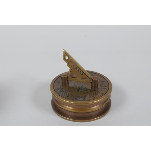 624 - A brass and glass ball desk clock and a Stanley style brass sundial clock and compass, 6cm diameter