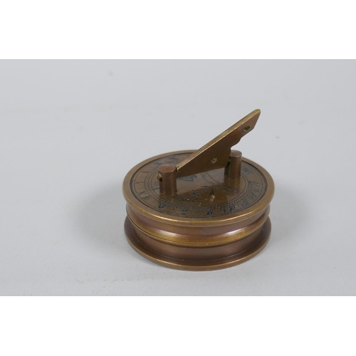 624 - A brass and glass ball desk clock and a Stanley style brass sundial clock and compass, 6cm diameter