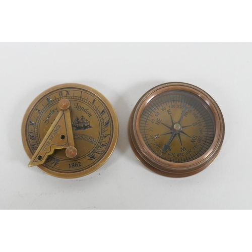 624 - A brass and glass ball desk clock and a Stanley style brass sundial clock and compass, 6cm diameter