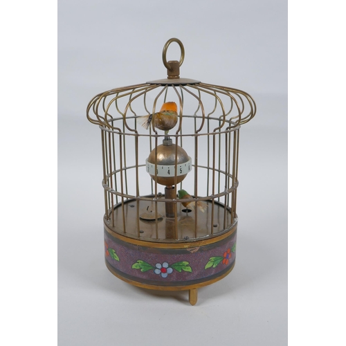 625 - A brass birdcage automaton clock with a decorative cloisonne band, 18cm high