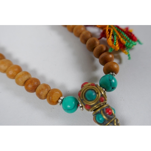 630 - Six assorted strings of Tibetan Mala beads including turquoise, bone, nut, stone etc