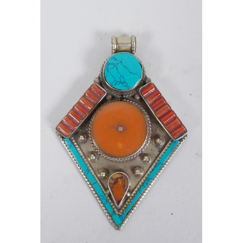 636 - A collection of Tibetan coral and turquoise set gilt metal pendants and rings