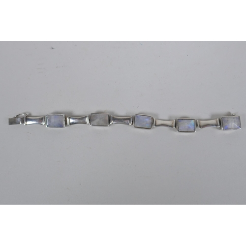 639 - A white metal bracelet, tests as silver, set with crystal gem stones, 17cm long