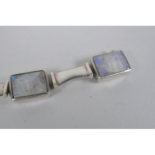 639 - A white metal bracelet, tests as silver, set with crystal gem stones, 17cm long