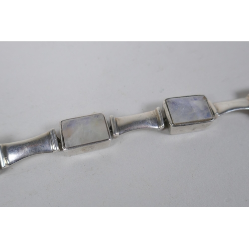 639 - A white metal bracelet, tests as silver, set with crystal gem stones, 17cm long