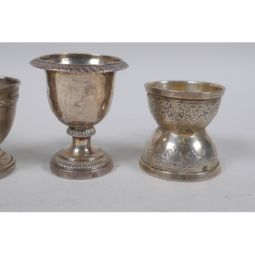 651 - Four C19th French silver egg cups and shaker top, 132g