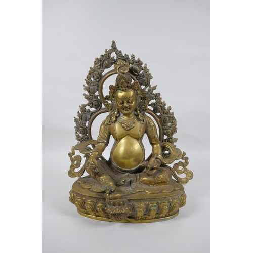 73 - A Tibetan bronze figure of Jambhala, 31cm high