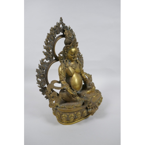 73 - A Tibetan bronze figure of Jambhala, 31cm high