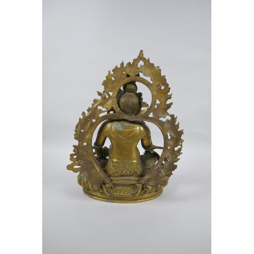 73 - A Tibetan bronze figure of Jambhala, 31cm high