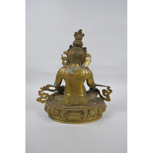 73 - A Tibetan bronze figure of Jambhala, 31cm high