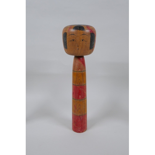 76 - Three Japanese Kokeshi dolls, largest 25cm high