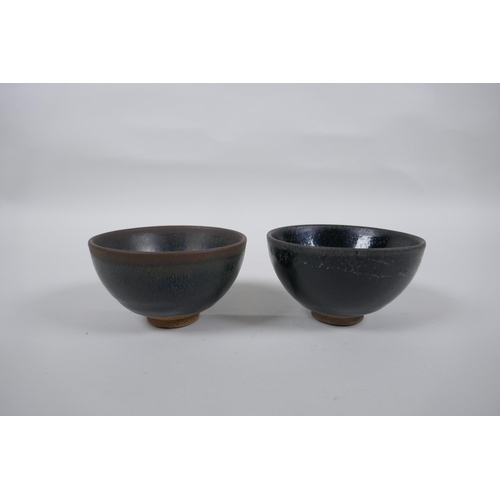 77 - A Chinese Jian Kiln tea bowl with hares fur glaze, and another with a treacle glaze, 9cm diameter