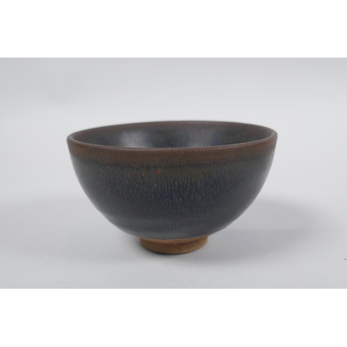 77 - A Chinese Jian Kiln tea bowl with hares fur glaze, and another with a treacle glaze, 9cm diameter