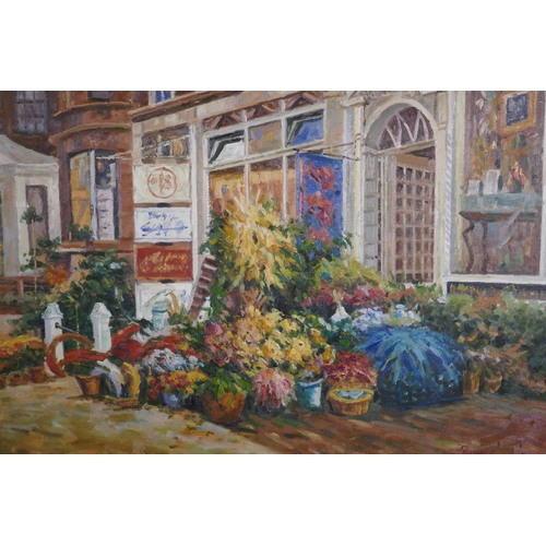 813 - Street scene with flower shop, signed Parker, late C20th, oil on canvas, 102 x 76cm