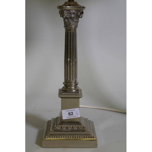 82 - An electro plated Corinthian column style table lamp with pleated shade, 56cm with shade, and a pair... 