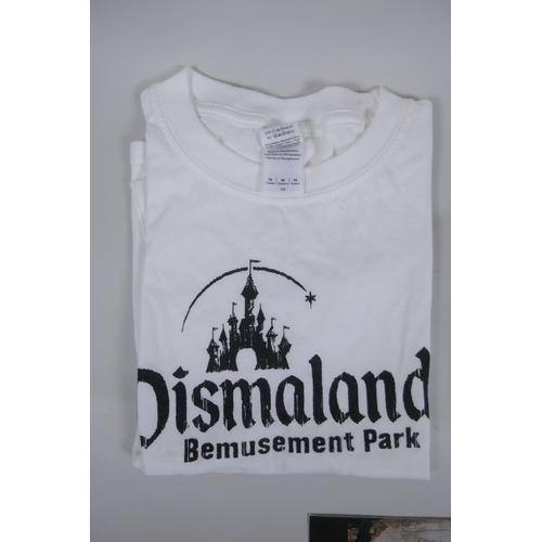 825 - After Banksy, a Dismaland brochure, Dismaland T-shirt (child size M), and two FCK-PTN! postcards, an... 