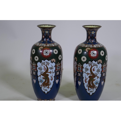 85 - A pair of antique chrome cloisonne vases with dragon and phoenix decoration, 30cm high, one dented