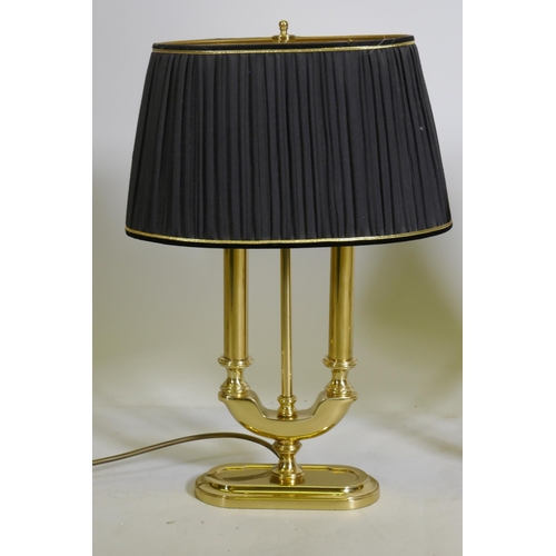 86 - A pair of brass two branch table lamps with pleated shades, 49cm high with shades