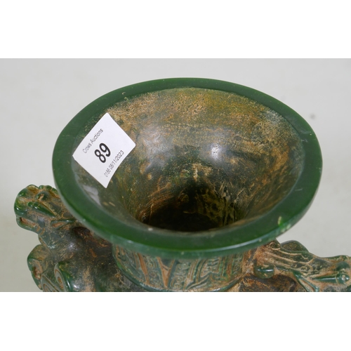 89 - A Chinese green hardstone vase with dragon decoration, 19cm high