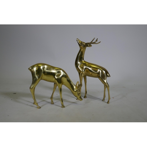 90 - A hollow cast brass figure of a stag and doe, 35cm high