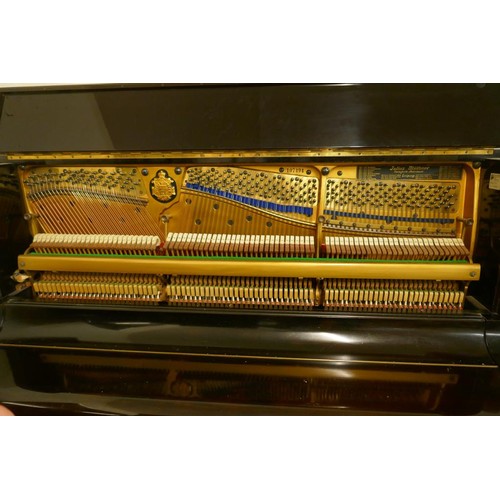 1070 - A 1920s Julius Bluthner upright pianoforte supplied by Waring and Gillow, with iron frame, No.107494... 