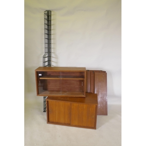 1159 - A mid century mahogany Ladderax style wall system of two cabinets and shelves, 178cm high