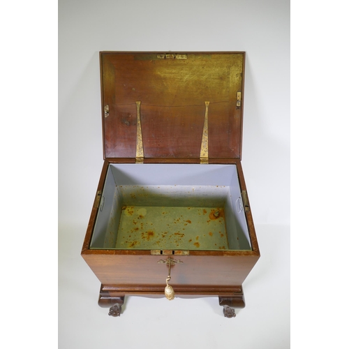 1145 - A George III mahogany wine cooler with lift up top and zinc lined interior, raised on a base with ca... 