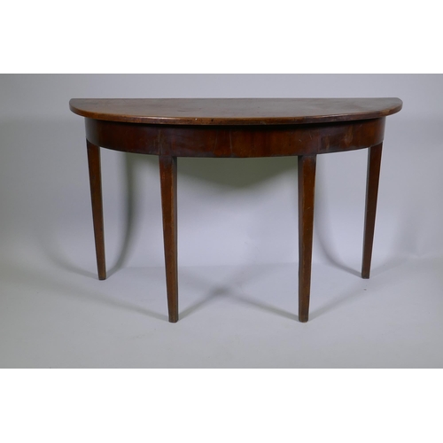 1146 - A C19th mahogany demi lune side table on square tapering supports, 122 x 46cm, 72cm high